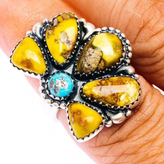 Sterling silver ring with oval yellow stones and small turquoise in dark bezel setting