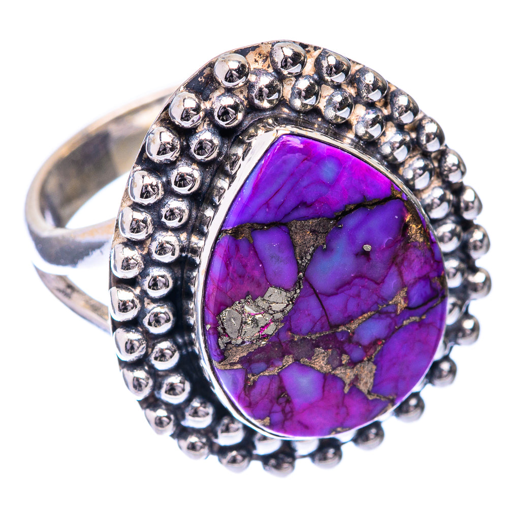 Sterling silver ring with oval purple turquoise stone and raised beaded frame.
