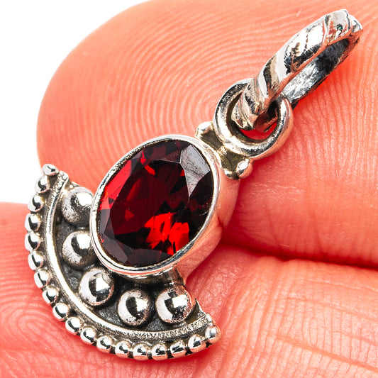 Garnet dainty pendant: oval red gemstone in ornate .925 sterling silver frame