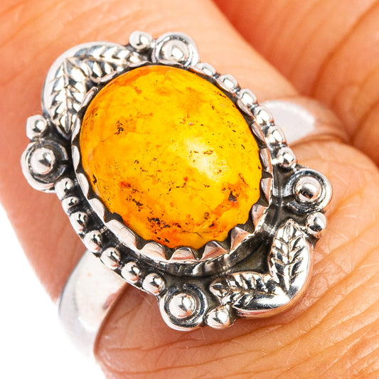 925 sterling silver ring with oval orange gemstone, ornate bezel and bead details