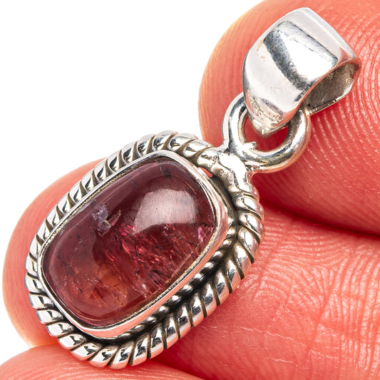 Pink tourmaline pendant close-up in .925 sterling silver oval bezel, rope edge