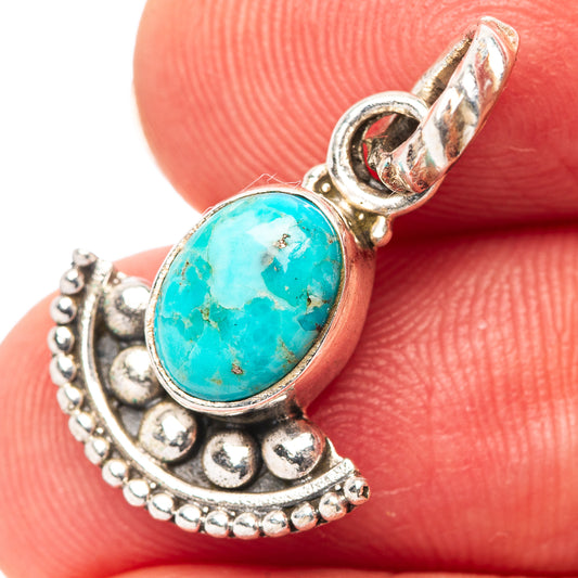 Turquoise oval pendant in .925 sterling silver bezel with scalloped crescent frame