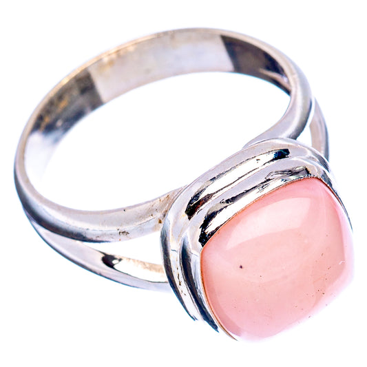 Sterling silver opal ring, pink oval stone set in open bezel with split band