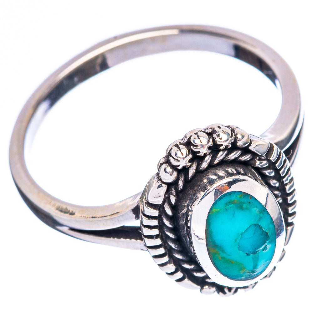 Sterling silver turquoise ring, ornate beaded bezel around oval blue-green stone