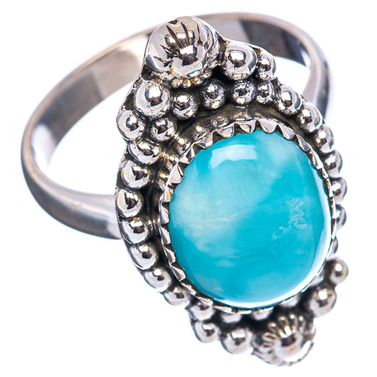 Oval blue stone ring in .925 sterling silver with raised beaded bezel
