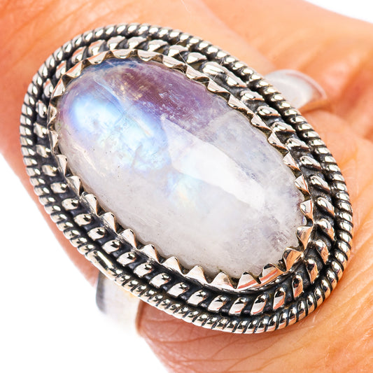 Oval rainbow moonstone cabochon ring in .925 sterling silver with rope border, close-up