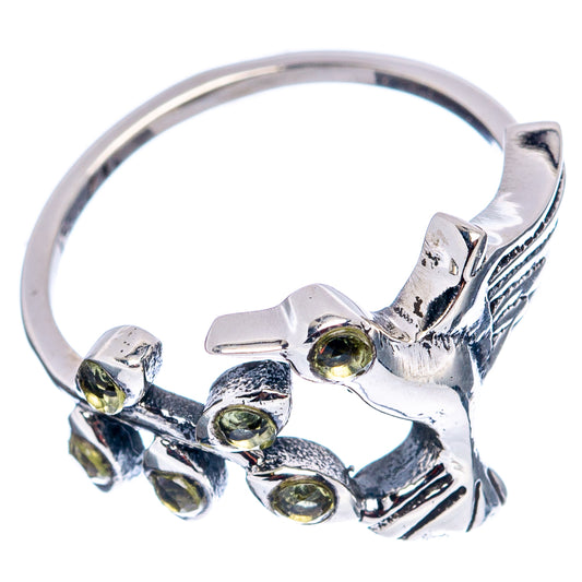 Sterling silver hummingbird ring side view with peridot green gemstone details