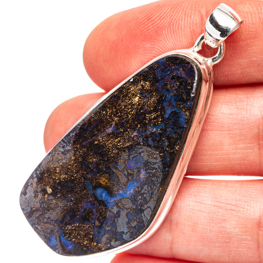 Sterling silver teardrop boulder opal pendant with polished bezel and loop bail