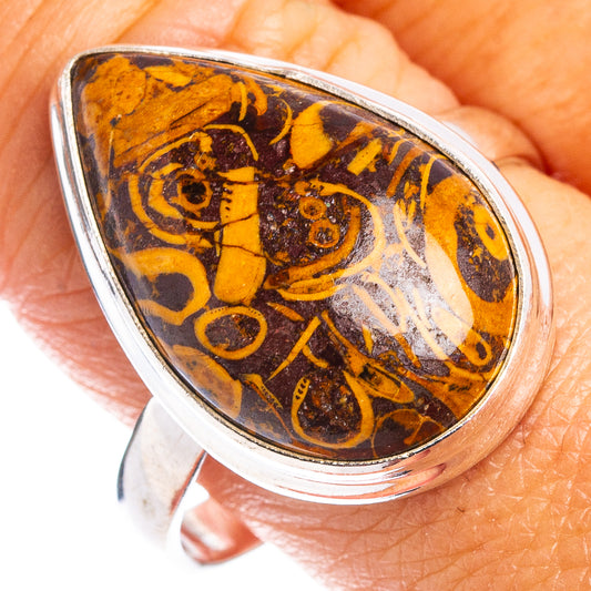 Sterling silver ring with oval amber fossil stone, ornate swirl pattern, size 11