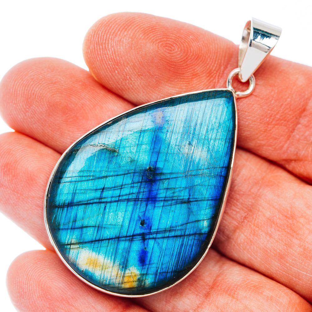 Sterling silver teardrop pendant with blue iridescent spectrolite gemstone