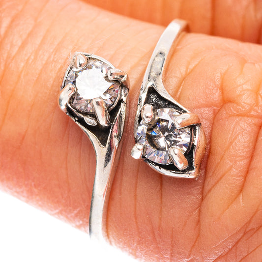 Sterling silver ring with two cubic zirconia stones, openwork side setting