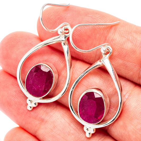 Sterling silver teardrop ruby earrings with round faceted red gemstones and hook backs