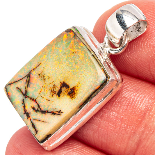 Sterling silver opal pendant with square frame and colorful rainbow stone detail.