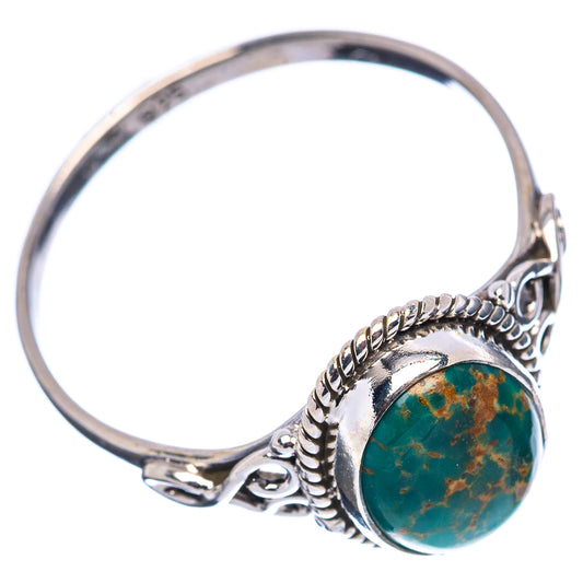 Oval turquoise cabochon sterling silver ring with braided side details