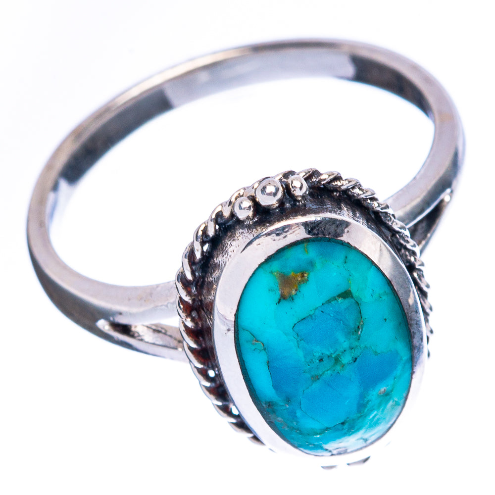 Oval turquoise cabochon ring, sterling silver band with rope-like bezel detail
