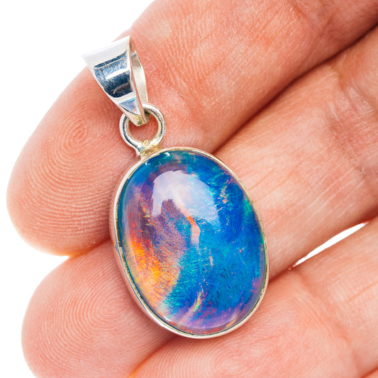 Oval opal pendant with .925 sterling silver bail and bezel, blue rainbow swirl.