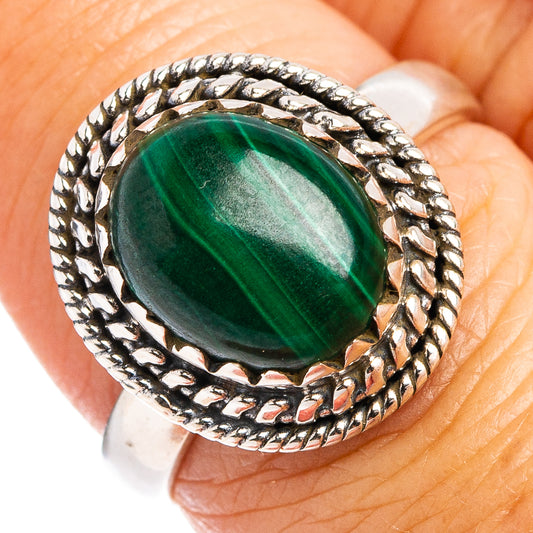 Sterling silver malachite cabochon ring with oval green stone and braided bezel