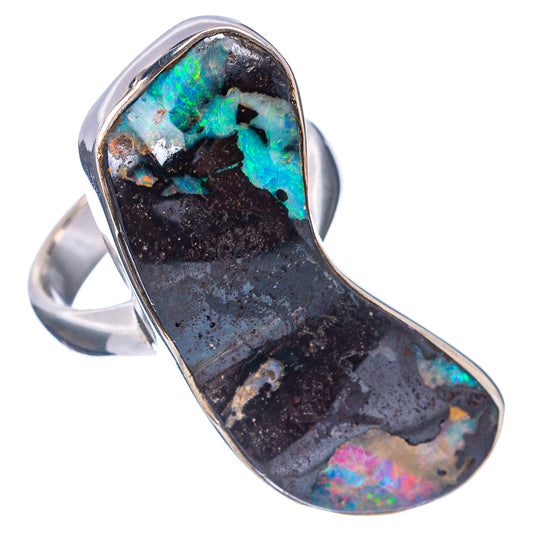 Sterling silver boulder opal ring with oval face, dark rock matrix and colorful iridescence.