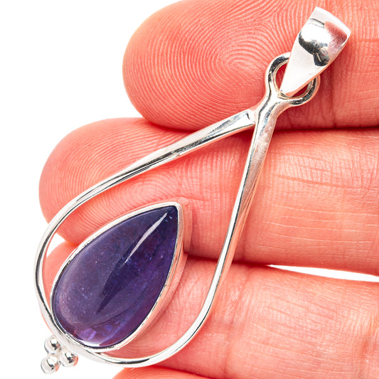 Sterling silver tanzanite pendant close-up with blue-violet teardrop gemstone in bezel.
