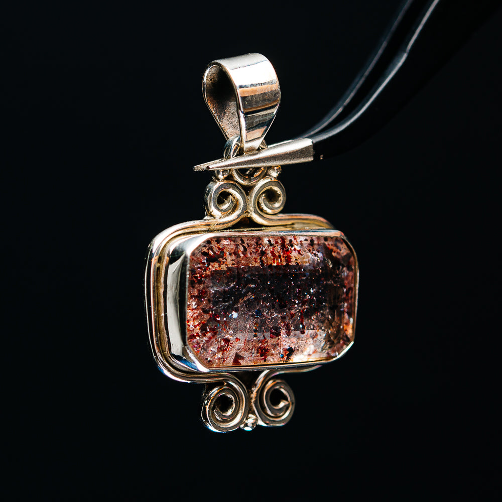 Sterling silver filigree pendant with rectangular faceted lepidocrocite stone, red flecks