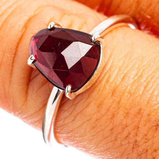 Sterling silver garnet ring with faceted dark red heart gemstone and three-prong setting