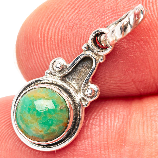 Turquoise pendant in .925 sterling silver with round green cabochon and decorative bail