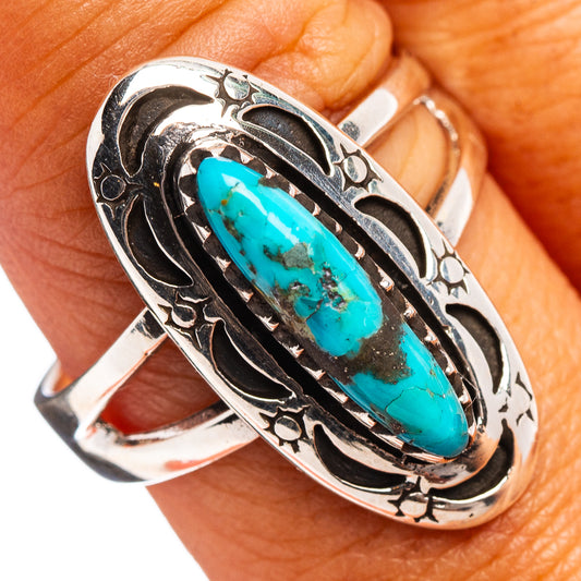 Sterling silver turquoise ring with oval cabochon and ornate black inlay