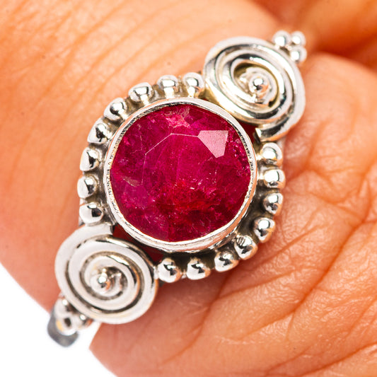 Sterling silver ring with round red gemstone and spiral side details, size 7