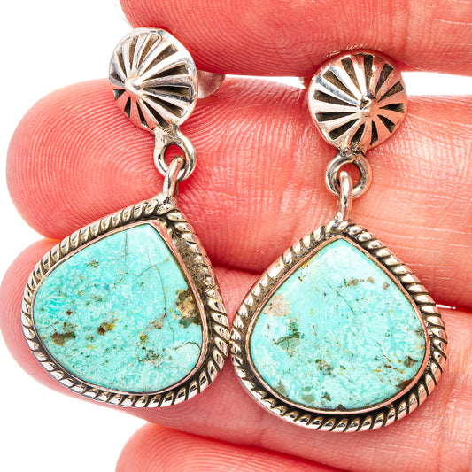Turquoise teardrop drop earrings with textured sterling silver bezel and hooked backs