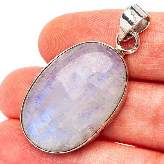 Oval moonstone pendant in silver bezel with shiny rainbow play-of-color and loop bail.