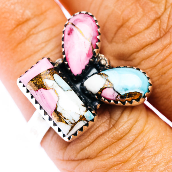 Southwestern-style ring with pink and turquoise teardrop stones in a black bezel setting