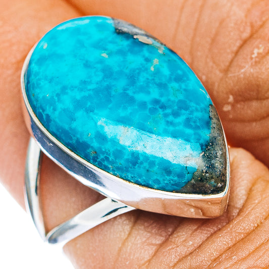 Turquoise cabochon ring in .925 sterling silver, oval blue stone on top.