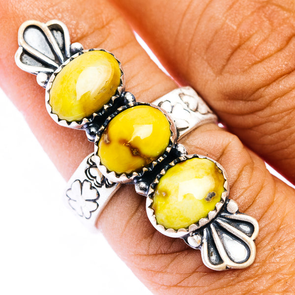 Silver statement ring with three yellow cabochon stones and leaf accents