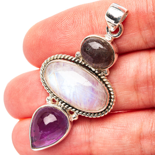 Sterling silver pendant with gray labradorite, oval moonstone, and purple amethyst