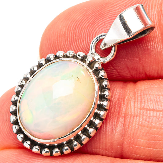 Sterling silver opal pendant with oval cabochon and beaded halo bezel