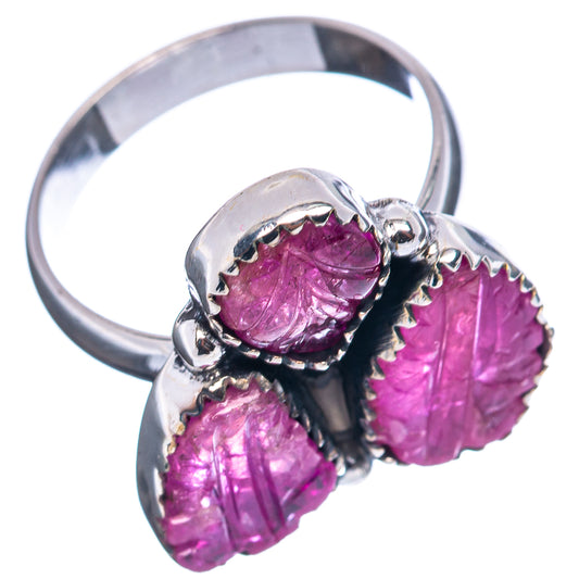 Sterling silver ring featuring three carved magenta ruby stones in a sculpted setting