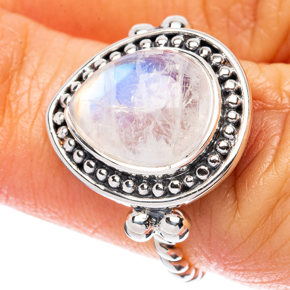925 sterling silver moonstone ring with oval cabochon on finger, beaded setting