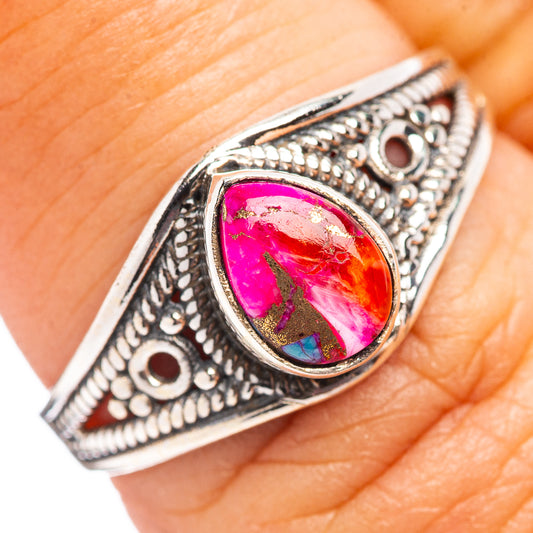 Sterling silver oval cabochon ring with pink and teal stone, ornate filigree band