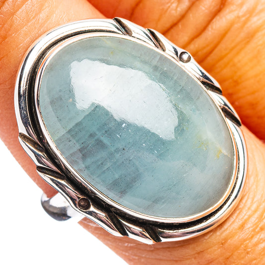 Oval aquamarine cabochon sterling silver ring with twisted bezel and side bands