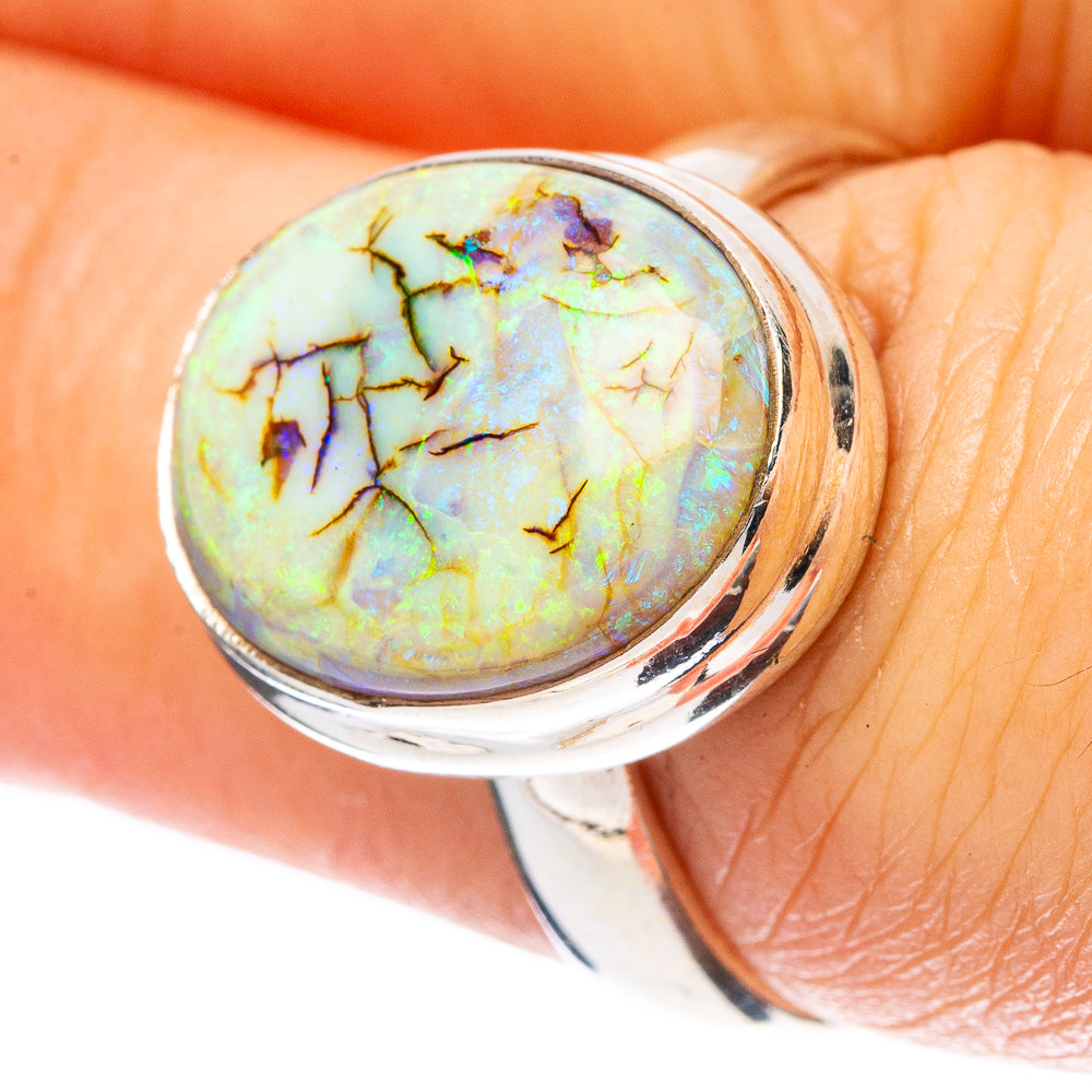 Size 7 sterling silver opal ring with round iridescent opal centerpiece and dark veining