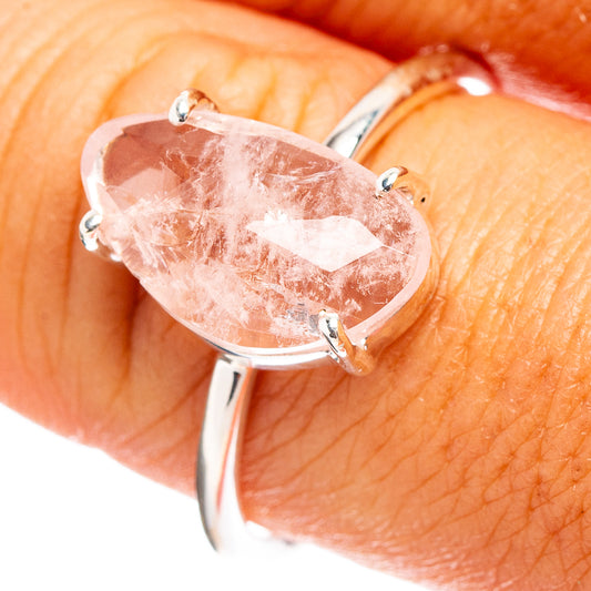 Pink faceted morganite ring with oval stone, four-prong sterling silver band
