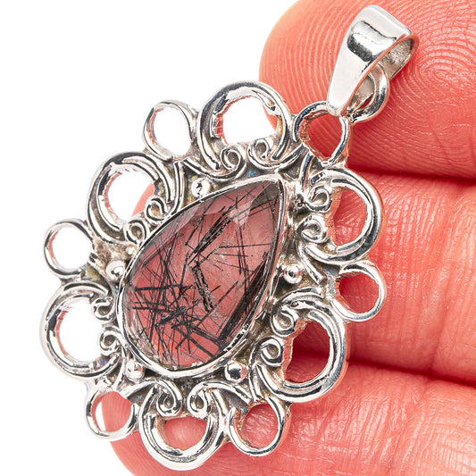 Sterling silver pendant with teardrop tourmalinated quartz cabochon and ornate filigree