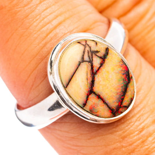Oval opal cabochon sterling silver ring with colorful mosaic pattern bezel