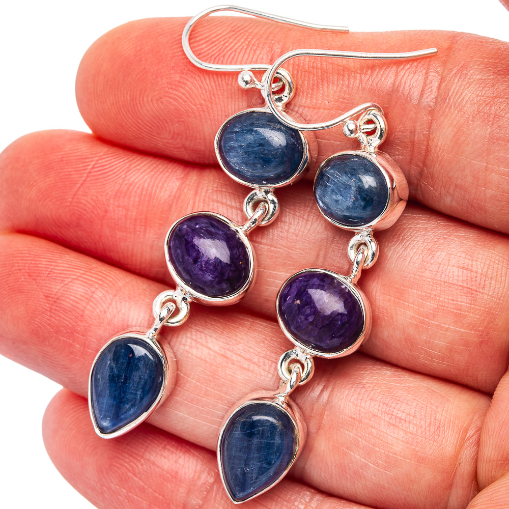 Sterling silver drop earrings with blue and purple gemstone teardrops and lever hooks