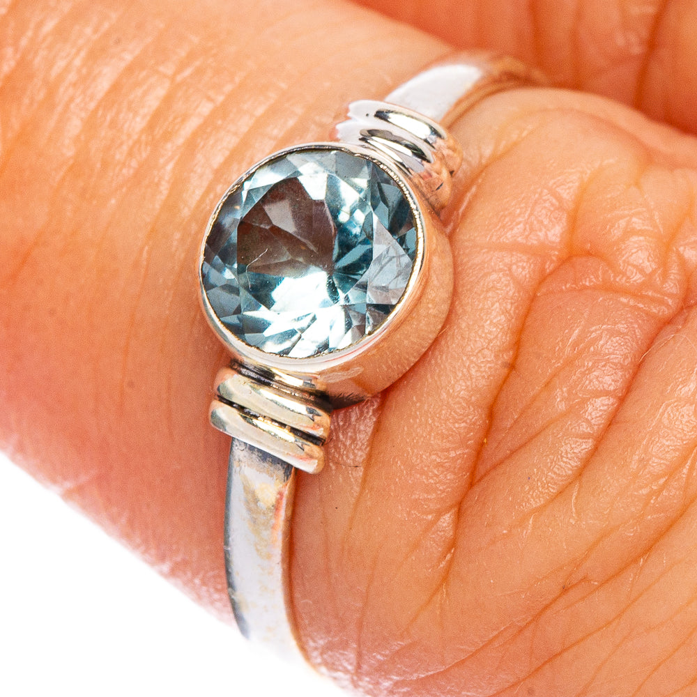 925 sterling silver ring with round blue gemstone, ridged band on finger