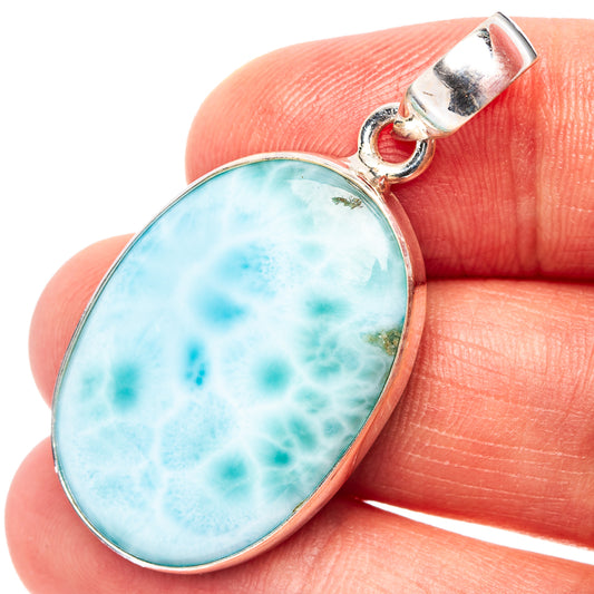 Oval larimar pendant in .925 sterling silver bezel, light blue mottled stone