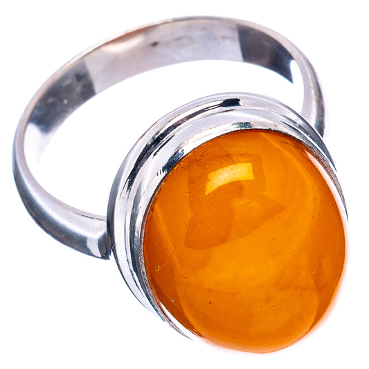 Sterling silver amber cabochon ring, oval face viewed at angle