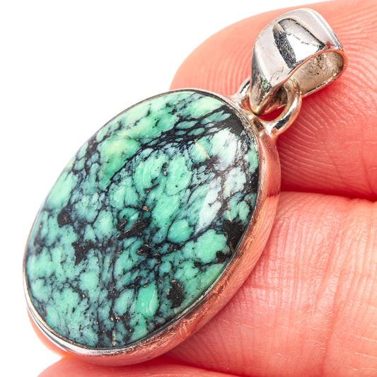 Turquoise bridge variscite pendant in oval silver bezel with bail, showing black vein pattern