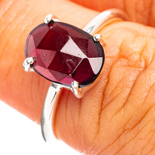 Garnet teardrop ring in .925 sterling silver, faceted dark red gem with three prongs