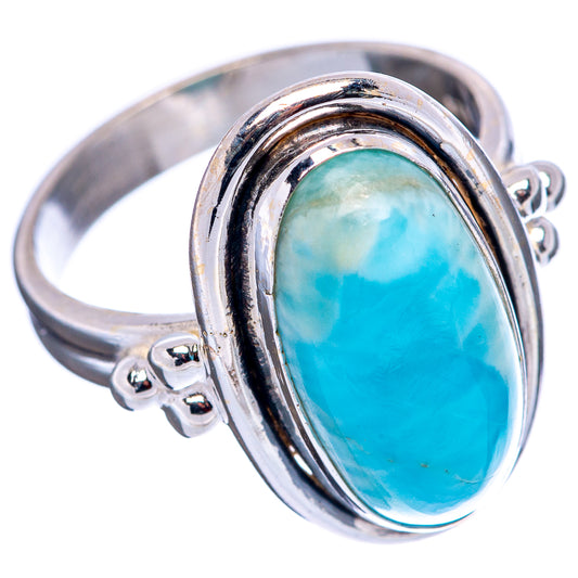 Sterling silver ring with oval blue-green larimar-style gemstone, open shank detail